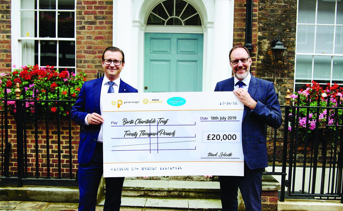 Merkur celebrate fantastic support for Bacta Charitable Trust with a smile